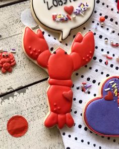 some decorated cookies on a table with confetti