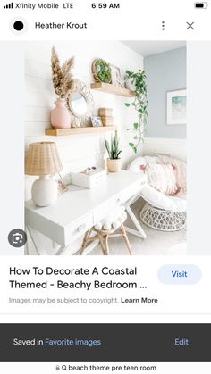 a white desk with some plants and pictures on the wall above it in a room