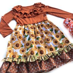 Our Autumn Flower Lola style dress is fashioned in a ruffle heathered Autumn Orange & a cotton ruffle skirting, perfect for wowing the crowd! Custom designed from a delightful mix of prints that please & colors that pop. Great for Thanksgiving, Fall portraits, school events, portraits, & everyday wear! All designs are tagged in the EVEN size. The model is 40.5”, 40lbs & modeling the sz 4/5 with a lot of room/length.Size/length: 2/3: 21”3/4: 22.5”4/5: 24”5/6: 25” 6/7: 26” 8: 28”Chest width unstretched: 2/3: 22”3/4: 22.5”4/5: 24” 5/6: 25”6/7: 26”8: 28” ✻ Ships in 1-4 days! Please leave a note during checkout if there is a specific date that you need your order by. ✻ We can typically accommodate rush orders, even large rush orders. Please inquire, by messaging me, with your needed date. Spring Floral Long Sleeve Dress With Ruffles, Casual Long Sleeve Fitted Twirl Dress, Casual Floral Print Twirl Dress For Spring, Fitted Floral Dress With Ruffles For Spring, Fitted Floral Dress With Tiered Skirt For Garden Party, Fall Cotton Floral Print Dress, Fall Floral Print Cotton Dress, Cute Floral Print Ruffle Dress For Spring, Fall Cotton Dress With Floral Print