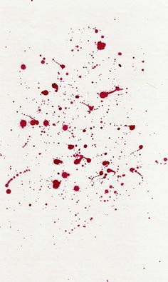 blood splattered on white paper with red ink