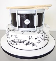 a cake with musical notes and drums on it