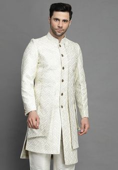 Art Silk Layered Sherwani in Off WhiteThis Readymade attire is Enhanced with Buttons, Resham and Sequins Work. Crafted in Chinese Collar Neck and Full SleeveAvailable with an Art Silk Pant in Off WhiteDo note: Kanthimala, Dupatta and Footwear shown in the image is for presentation purposes only. Half to one inch may vary in measurement. (Slight variation in actual color vs. image is possible) We sell all kinds of menswear. Mens Kurta | Mens Kurta Pajama | Mens Sherwani | Mens Sherwani Sets | Tra Traditional Bandhgala With Intricate Embroidery In Art Silk, Traditional Cream Embroidered Bandhgala, Traditional Art Silk Sherwani With Intricate Embroidery, Traditional Semi-stitched Bandhgala With Cutdana, White Traditional Festive Bandhgala, Traditional White Bandhgala For Festive Occasions, Unstitched Embroidered Off White Bandhgala, Off White Bandhgala For Festive Occasions, Festive Off White Bandhgala