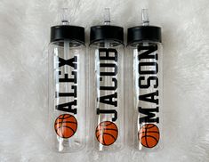 two water bottles with basketball designs on them