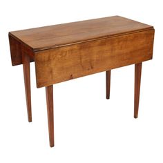 an old wooden table with two legs and a drawer on the top, isolated against a white background