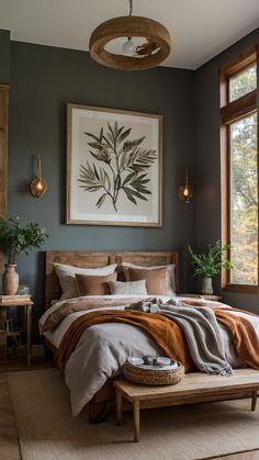 a bedroom with a large bed in the middle and paintings on the wall above it