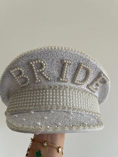 Make the bride feel incredible on her hen party with this stunning bridal hat! This embellished hat is a must-have for any bride to make her feel extra special - plus, it is the perfect instagrammable bridal hat! Style this glamorous bride hat with hen party decorations and accessories from our Hen Weekend collection, perfect for those brides who want a trip away! Each pack contains 1 x Bride to Be hat measuring 28cm (H) x 28cm (W) White Cap Mini Hat For Weddings, Embellished Party Cap, Lace Table Runner Wedding, Glitter Hat, Pilot Hat, Hen Party Decorations, Dope Jewelry Accessories, Hen Weekend, Bride Hat