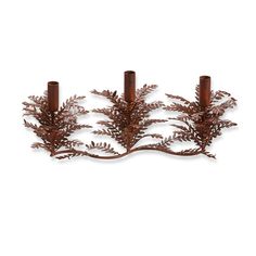 three candle holders made out of metal with leaves on the top and one is brown