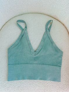 Introducing the Kalani Tank in Vintage Sage. This seamless tank top features a vintage wash for a unique and stylish look. Crafted with quality and comfort in mind, this tank will elevate your wardrobe and provide a smooth, flattering fit. Perfect for any occasion. one size fits all but fits sizes XS-XL best ✨ Seamless Sleeveless Tops For Loungewear, Green Seamless Top For Loungewear, Trendy Cotton Tank Top With Seamless Construction, Trendy Cotton Seamless Tank Top, Green Cotton Tank Top With Built-in Bra, Comfortable Sleeveless Cotton Tank Top, Cotton Tank Top With Tank Straps For Yoga, Cotton Tank Top For Yoga, Comfortable Bra-friendly Summer Tops