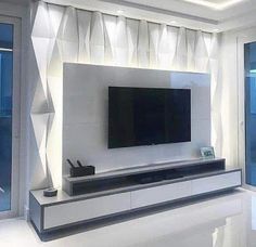 a flat screen tv mounted to the side of a wall