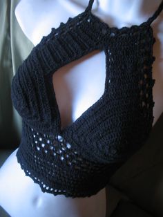 a black crochet halter top on a mannequin