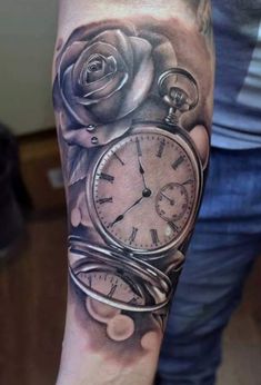 an arm with a clock and roses on it