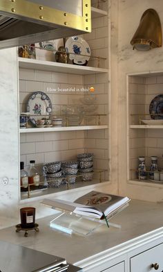 an open book on a counter in a kitchen