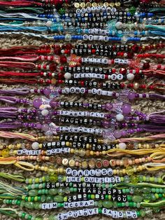 many bracelets are stacked on top of each other