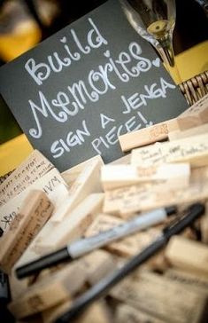 a pile of wine corks sitting on top of a table next to a sign