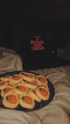 a plate full of food sitting on top of a bed