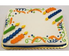 a decorated sheet cake with candles on it