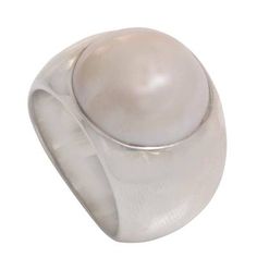 Caine designs a captivating ring that bubbles with shimmering elegance. He selects a white mabe pearl to contrast with silver's sterling brightness. Mabe pearls are hemispherical; they are made to grow against the inside shell of an oyster rather than within its body. .925 Sterling silver Elegant Round Mother Of Pearl Ring, Elegant White Domed Rings, Elegant White Domed Jewelry, Elegant White Mother Of Pearl Ring, White Mother Of Pearl Round Pearl Ring, Modern Round Pearl Rings, Modern White Pearl Ring, Elegant Mother Of Pearl Round Rings, Classic Mother Of Pearl Round Rings