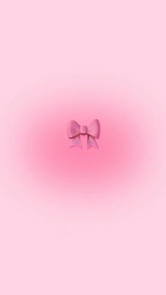 a pink wall with a bow on it