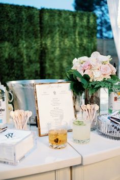 a table with drinks and menus on it