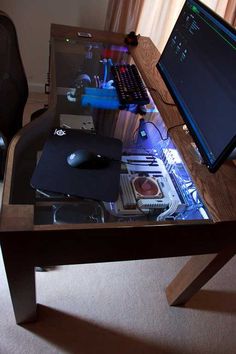 a desk with a computer and mouse on it