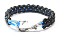 a black and blue rope bracelet with an anchor