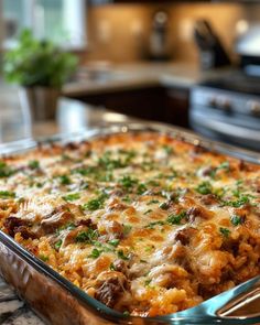 a casserole dish with meat, cheese and parsley on the top is ready to be eaten