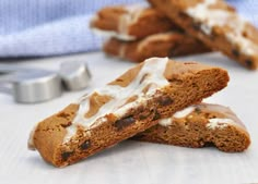 two cookies with white icing and chocolate chips