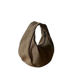 Constructed with heavy-duty canvas, fabric remnants and a reinforced inner lining, the Slouchy Moon Bag features two interior pockets for your essentials and a zip closure for secure storage. Fabric: 100% Cotton Slouchy Bag, Moon Bag, Mini Moon, Sack Bag, What In My Bag, Round Bag, Wallet Pouch, Fabric Remnants, Purse Accessories