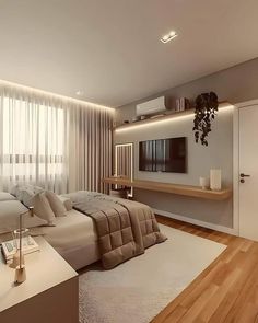 a modern bedroom with wood floors and white walls