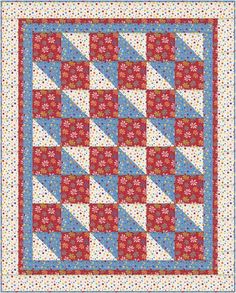 a red, white and blue quilt with flowers on the border is featured in this image