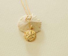 "sand dollar necklace gold dainty sand dollar necklace for beach lovers necklace gift  length:17\"+2\" as shown on the pictures  pendant size:14mm x 14mm material:18K gold dipped over brass available: gold *Your item will arrive in a beautiful gift box - Ready for Gift Giving! View more jewelry HERE:  https://www.etsy.com/shop/DearMia?ref=listing-shop2-all-items-count#items" Dainty Round Jewelry For Beach, Ocean-inspired Gold Round Pendant Jewelry, Gold Ocean-inspired Round Pendant Jewelry, Dainty Gold Jewelry For Vacation, Gold Dainty Necklace For Vacation, Dainty Gold Necklace For Vacation, Ocean-inspired Round Gold Necklace, Adjustable Gold Ocean-inspired Charm Necklace, Minimalist Gold Necklaces For The Beach