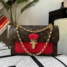 Brand New In Box Comes With Dustbag, Box And Receipts Hard To Take Pictures Of The Date Code. Length: 10.25 In Height: 6.5 In Width: 3.25 In Drop: 12.25 In Drop: 22 In This Chic Shoulder Bag Is Crafted Of Louis Vuitton Monogram Coated Canvas With A Cross-Over Flap. The Bag Features Polished Brass Bijoux Chain Link Shoulder Straps And A Facing Brass Press-Lock For The Flap. This Opens To A Front Patch Pocket And A Partitioned Black Microfiber Interior With A Zipper Compartment. Make A Reasonable Elegant Monogram Canvas Box Bag With Dust Bag, Formal Monogram Canvas Box Bag With Dust Bag, Formal Monogram Canvas Box Bag, Designer Rectangular Shoulder Bag With Lock, Luxury Rectangular Shoulder Bag With Lock, Elegant Monogram Canvas Bags In Rectangular Case, Elegant Monogram Canvas Rectangular Case Bag, Light Luxury Rectangular Box Bag For Formal Events, Designer Red Rectangular Case Bag