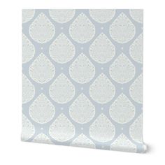 a blue and white wallpaper with an intricate design