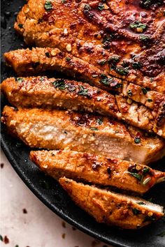 grilled pork chops in a cast iron skillet