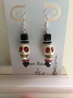 Gothic Skull Earrings For Party, Adjustable Gothic Skull Earrings, Skull Jewelry For Day Of The Dead Party, Skull Shaped Jewelry For Day Of The Dead Party, Gothic Skull Earrings For Halloween, Adjustable Black Skull-shaped Earrings, Adjustable Black Skull Earrings, Halloween Skull Print Earrings, Black Skull Earrings For Parties