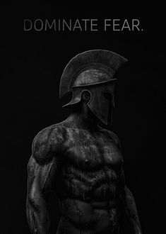 a black and white photo of a man wearing a helmet with the words dominate fear on it