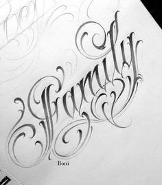 some type of lettering that is on top of paper