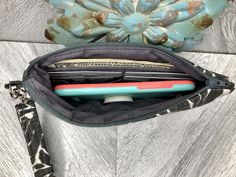 "This cute wristlet wallet is the perfect go to alternative to our everyday handbags! It will hold all your necessities including credit cards, ID and your smartphone. Super convenient for the mom on the go!! This sleek and contemporary wristlet clutch was designed using a charcoal gray and white slub canvas fabric. It has a tan vegan leather base and a detachable strap. The well organized interior is a solid black fabric that has 4 credit card slots with a slip pocket behind it to hold cash. Th Black Wristlet With Cell Phone Pocket For Gift, Black Wristlet With Cell Phone Pocket As Gift, Travel Wristlet With Cell Phone Pocket, Everyday Clutch Wristlet With Cell Phone Pocket, Casual Wristlet With Zipper Pouch For Everyday Use, Casual Everyday Wristlet With Zipper Pouch, Adjustable Wristlet With Cell Phone Pocket For Everyday Use, Adjustable Wristlet With Cell Phone Pocket For Gifts, Casual Rectangular Wristlet With Zipper Pouch