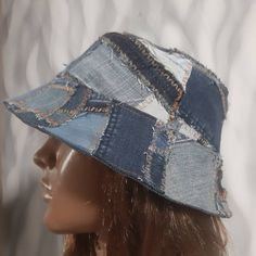 a mannequin head wearing a hat made out of old jeans and denims