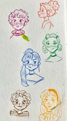 four different colored children's faces drawn on paper