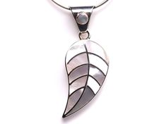 "// Mother of Pearl Leaf Inlay Pendant // Includes genuine gemstones! // This beautiful inlay pendant has been handcrafted in Peru. The craftsmanship is amazing! The metal is made of solid .950 sterling silver, which means it is a higher purity than standard .925 sterling silver.  The gemstones included are: Mother of Pearl We only have one of these pendants and you will receive the exact item in the photos! The pendant measures 5/8\" wide, and 1 5/8\" long including the bail.  Choose pendant on Handmade White Leaf-shaped Jewelry, White Leaf-shaped Jewelry Gift, White Pendant Necklace With Inlay, White Necklace With Inlay For Gift, Leaf Jewelry, Sterling Silber, Peru, Mother Of Pearl, Sterling Silver Jewelry