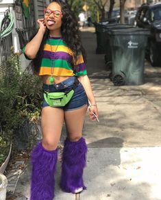 a woman in purple furry boots talking on a cell phone