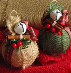 two burlocks are sitting on a red blanket