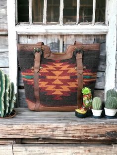 "Woven Wool Saddle Blanket & Leather Tote Bag The Alamo  Woven Saddle blanket with beautiful antiqued brass hardware, top grain leather back and handles, snap top opens to two slip pockets and one zipper pocket.  17\" x 14\" x 6\"" Vintage Brown Satchel For Fall, Fall Shoulder Bag With Snap Closure, Brown Satchel With Snap Closure For On-the-go, Fall Bags With Brass Hardware, Fall Travel Satchel With Leather Handles, Brown Bags With Brass Hardware And Double Handle, Everyday Bags With Brass Hardware For Fall, Vintage Brown Bag For Fall, Vintage Tote Shoulder Bag For Fall