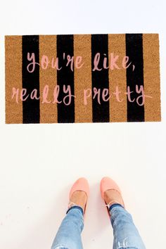 someone is standing in front of a door mat that says you're like, really pretty