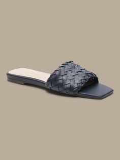 Modern mastery, these square-toe slide sandals have an intricately woven leather construction to add luxurious texture to your look.  Leather uppers.  Leather lining.  Flexible skid-resistant outsole with comfort pod at bottom.  Whole or half sizes. Synthetic Woven Leather Slide Sandals, Synthetic Woven Leather Open Toe Slides, Open Toe Synthetic Slides With Woven Leather, Synthetic Woven Leather Open Toe Mules, Synthetic Open Toe Mules With Woven Leather, Synthetic Open Toe Woven Leather Mules, Open Toe Synthetic Woven Leather Mules, Woven Leather Sandals, Square Toe Sandals