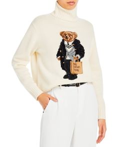 150TH Anniversary Exclusive:This exclusive turtleneck sweater features Polo Ralph Lauren's beloved mascot, the Polo Bear, intarsia-knit with hand-embroidered detailing. Dressed for a day of shopping in the city, the Polo Bear wears a duffel coat, herringbone blazer, and cricket sweater, and carries our iconic Big Brown Bag. The sweater is finished with signature Rl chain-stitched embroidery at the hem and an exclusive label at the inside back neck to commemorate our 150th anniversary.Features: Polo Bear Outfit Women, Lydia Outfits, Cricket Sweater, Ralph Lauren Purple Label Men, Ralph Lauren Womens Clothing, Cotton Cable Knit Sweater, Duffel Coat, Turtleneck Tunic Sweater, Cable Knit Sweater Womens