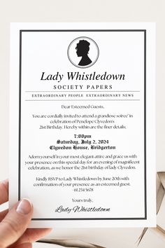 a lady whistledown society paper is being held up