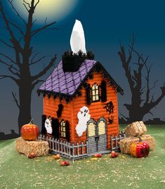 a halloween house with pumpkins and hay bales