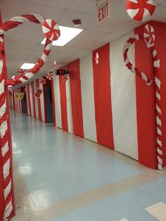 the hallway is decorated in red and white candy canes